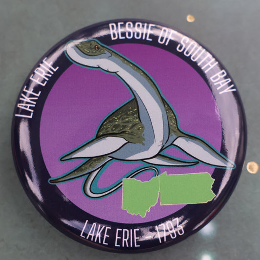 Cryptid Bessie with text around button pin