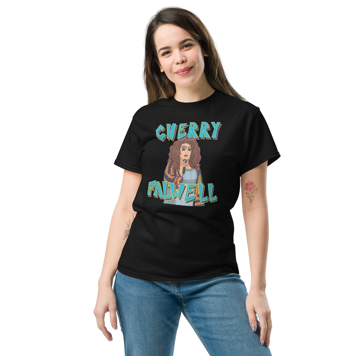 Woman wearing a black t-shirt with colorful graphic design of a drag queen with text ‘cherry falwell’ on a white background
