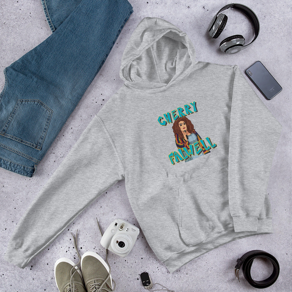 Gray hoodie with 'Cherry Maxwell' graphic on a gray surface with jeans, phone, and shoes.