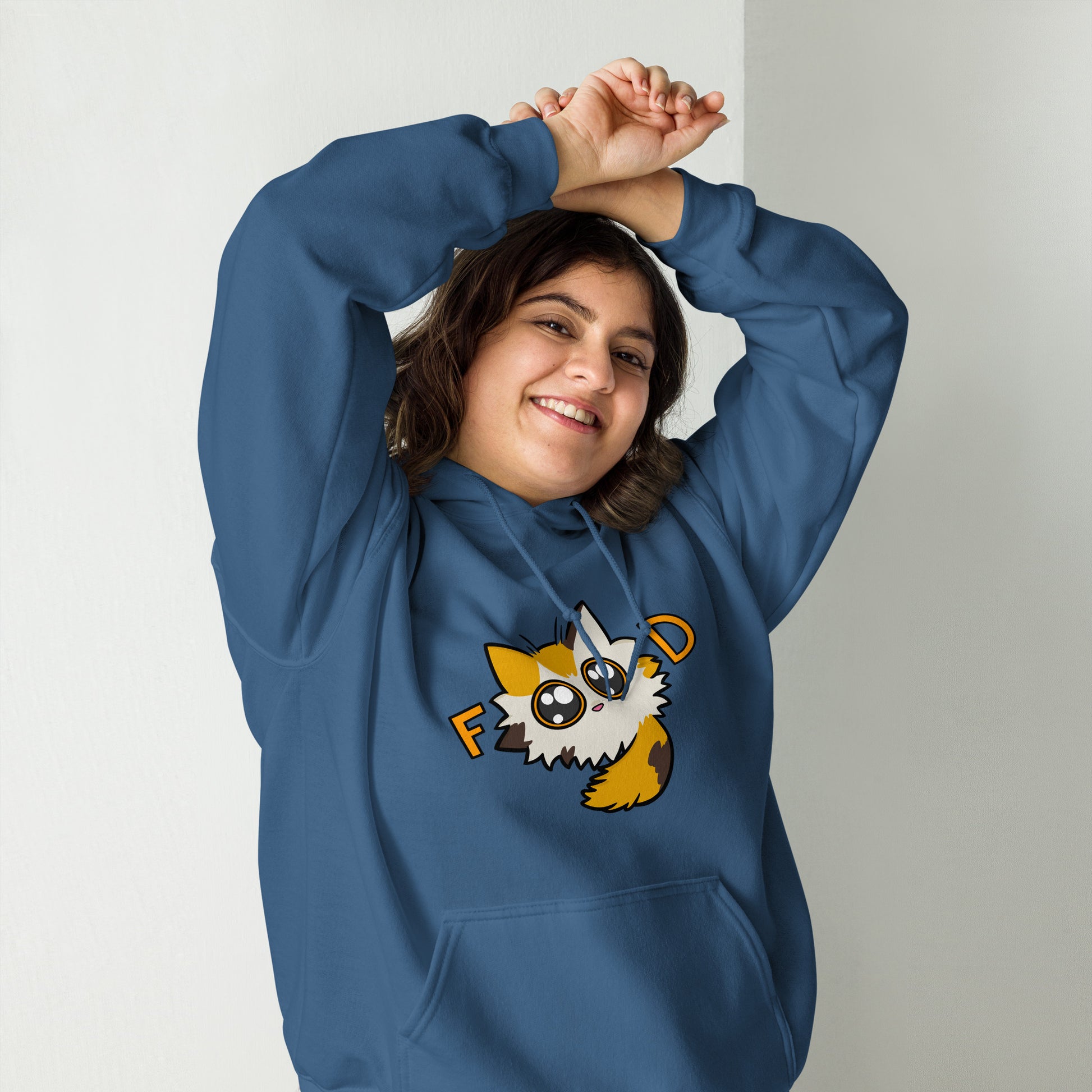 Person wearing a blue hoodie with a cartoon cat character on a plain background