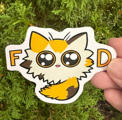 Cartoon calico cat sticker with “food” spelled with the eyes