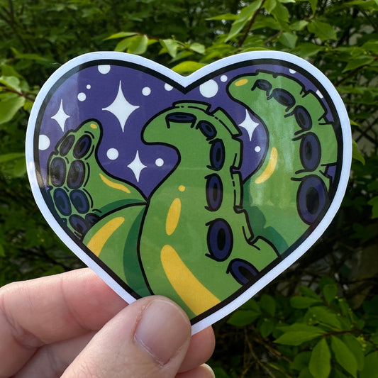 Heart shaped sticker with green tentacles on a purple background