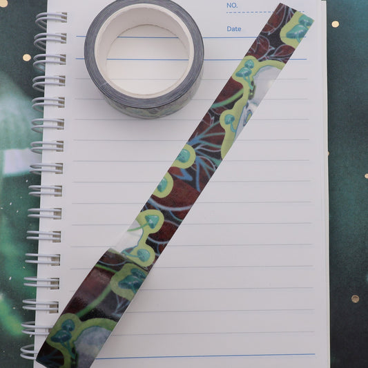 Raven skull with glowing mushrooms washi tape on journal.