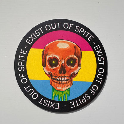 Round magnet with a skull over a pansexual pride flag encircled by the text exist out of spite