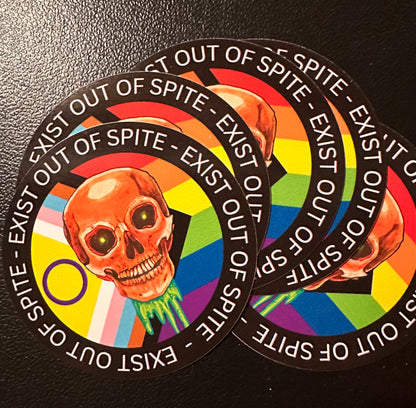 Round sticker 5 pack with a skull over a pride flag encircled by the text exist out of spite